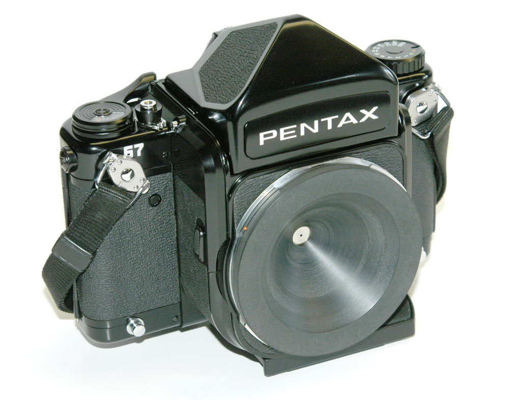 A custom pinhole bodycap for a Pentax 67. A custom pinhole bodycap for a Pentax 67.